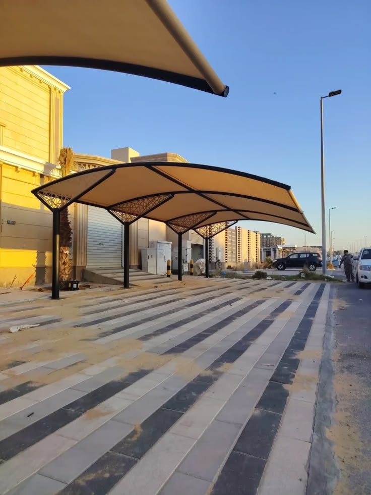 صورة توضيحية لأعمال مظلات سيارات